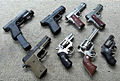 Clockwise from top left: Glock 22, Glock 21, Kimber Custom Raptor II, Dan Wesson 1911, S&W .357 mag, Ruger Blackhawk, Ruger SP101, Sig Sauer P220 Combat.