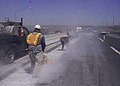 Highway road workers use high power saws (9245786301).jpg