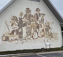 Gaugel's sgraffito Immigration, the sgraffito at the Amish and Mennonite Information Center (cropped).jpg