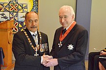 McLay (right), after his investiture as a Knight Companion of the New Zealand Order of Merit by the governor-general, Sir Jerry Mateparae, on 27 August 2015 Jim McLay KNZM investiture.jpg