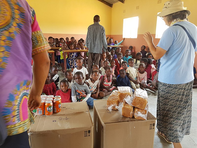 File:Korean missionaries donating food to village children.jpg