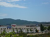 La Coscollada, a la serra de Marina, vista des de la passera de vianants sobre el riu Ripoll i l'autopista a Ripollet.