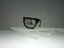 A fragment of Salvador Allende's eyeglasses, found after his death. Lentes Salvador Allende.jpg