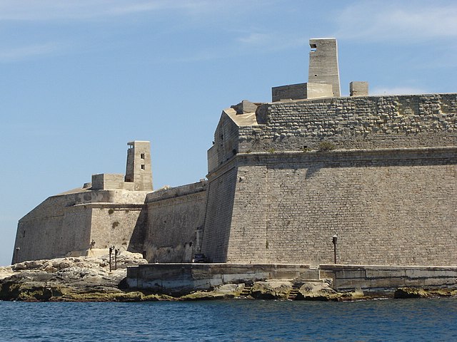 The Carafa Enceinte. The towers on top of the bastions are concrete coastal defences built in World War II.