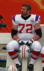 A light-skinned man wearing American football attire