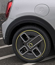 Styling details: "Corona/Power Spoke" wheels and the E/plug ambigram embossed on the charge port door Mini Hatch (F56) Electric styling details ("Power Spoke" wheels, E or plug ambigram).jpg