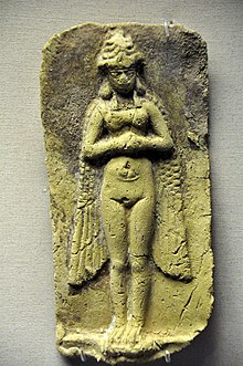Mold-pressed fired clay plaque. It depicts a nude, horned, and winged female figure (deity) having talon-shaped feet. Her hands are clasped on her chest (unlike the figure on the Burney relief). Old-Babylonian period, from Iraq. British Museum Mold-pressed fired clay plaque. It depicts a nude, horned, and winged female figure (deity) having talon-shaped feet. Her hands are clasped on her chest. Old-Babylonian period, from Iraq.jpg