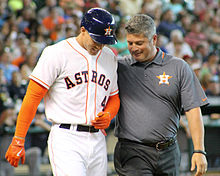 Athletic trainer Nate Lucero (right) evaluates Houston Astros baseball player George Springer after Springer was hit by a pitch in 2014 Nate Lucero and George Springer in June 2014.jpg