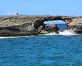 Large hole through island off La'ie Point, Oahu