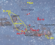 Close up on the Orion Arm, with major stellar associations (yellow), nebulae (red) and dark nebulae (grey) coreward from the Local Bubble with Rho Ophiuchi.