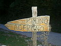 Wood-made road sign at Croce di Pruno