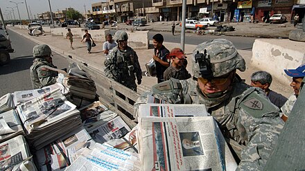 U.S. Army PSYOP soldiers with Detachment 1080, 318th Psychological Operations Company distribute newspaper products in the East Rashid region of Baghdad, Iraq, July 11, 2007.