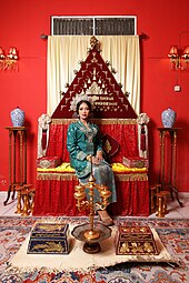 A Delinese Malay woman in the traditional wedding costume from North Sumatera, Indonesia Pakaian wanita pengantin Melayu Deli zaman kini dengan kain songket corak daun inai 3.jpg