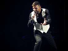 Ricky Martin achieved his first chart-topper with "Vuelve" which was named the best-performing song of the year. Ricky Martin in performance (2011).jpg