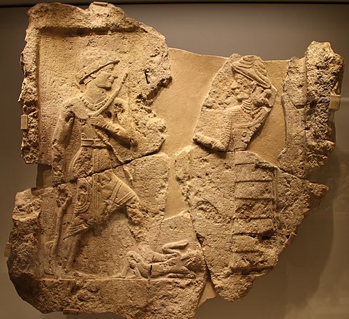 King Iddin-Sin of the Kingdom of Simurrum, holding an axe and a bow, trampling a foe (c. 2000 BCE). Israel Museum.