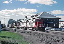 A Soo Line Railroad train passing through Stevens Point in 1964 SOO GP30 702 at Stevens Point, WI in October 1964 (34347357011).jpg