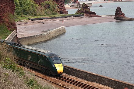 Great Western Railway Class 802 passes through Shell Cove at Dawlish.