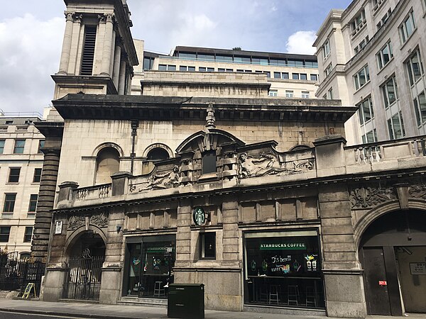 The entrance to the former C&SLR station, now a branch of Starbucks, with the church of St Mary Woolnoth behind.