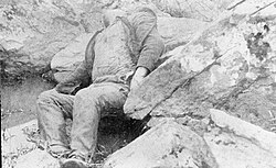 Dead Confederate soldier in the "Slaughter Pen" at the foot of Big Round Top. The American Civil War, 1861 - 1865; corpse on the field of Gettysburg Q44184.jpg