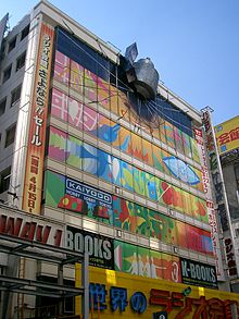 A promotional model of the crashed time machine on the real life Radio Kaikan building in Akihabara in October 2011