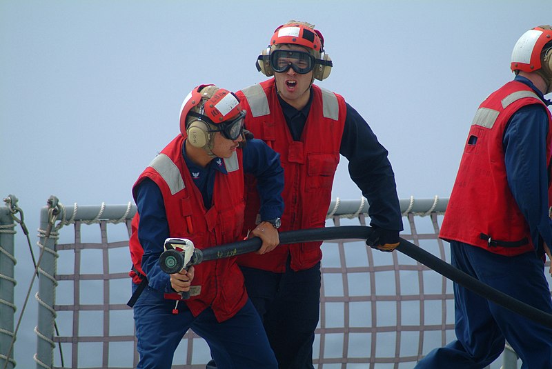 File:US Navy 060411-N-4772B-036 Electronics Technician 3rd Class Julian Ayala and Hull Maintenance Technician Fireman Michael D. Elliott conduct firefighting efforts during a crash and smash drills.jpg