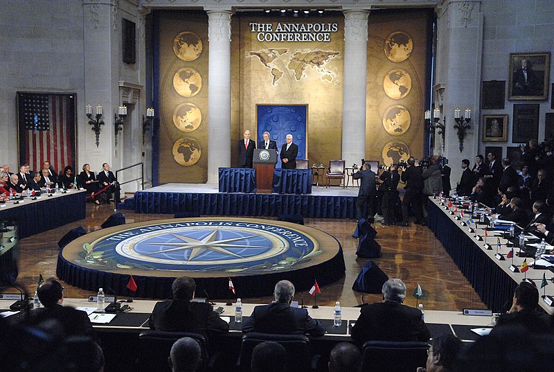 File:US Navy 071127-N-8395K-001 Israeli Prime Minister Ehud Omert, left President George W. Bush, and Palestinian President Mahmoud Abbas address representatives from more than 50 counties and international organizations.jpg
