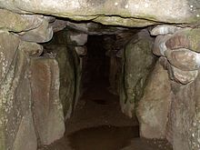 The interior of West Kennet Long Barrow in Wiltshire. Long barrows such as this one were the dominant form of megalithic architecture before the development of the stone circle tradition. WKLB Mittelgang DB.jpg