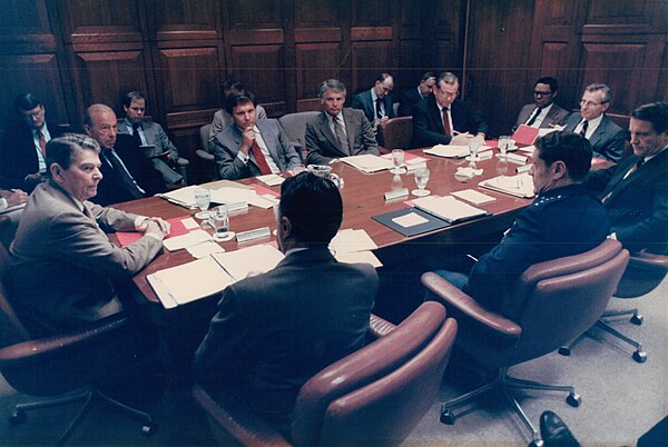 President Ronald Reagan's National Security Council. Participants include George Shultz, William F. Martin, Cap Weinberger, Colin Powell and Howard Ba