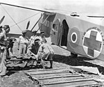 A patient being loaded on a No. 1 Air Ambulance Unit aircraft in Scily in September 1943