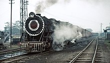 Metre gauge class YG 2-8-2 no. 4288, built by Nippon in 1956, departs from Gorakhpur with an evening train. These locomotives usually carried smoke deflectors 888 IndiaGorakhpur 19931228.jpg