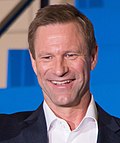 Aaron Eckhart (29830286295) (May2021 crop).jpg