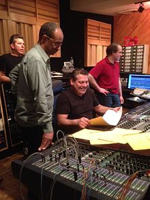 Andy McKee (background left) with Douglas Purviance, Luis Bonilla and Michael Marchione during recordings for Mists: Charles Ives for Jazz Orchestra, April 2014 Andy, Doug, Mike and Luis listening to playback.JPG