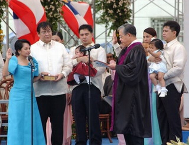 Arroyo taking her Oath of Office for a full term as president before Chief Justice Hilario Davide Jr. in Cebu City on June 30, 2004.
