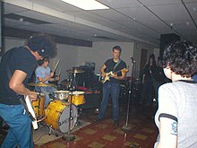 Calvin Johnson (pictured in the middle) playing in 2002 at Dub Narcotic where Elverum recorded the album. Beat Happening.jpg