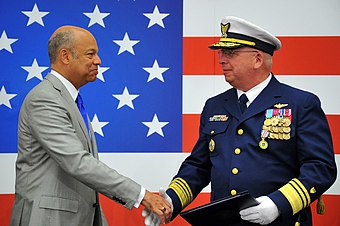 Outgoing Coast Guard vice commandant, Vice Adm. John P. Currier is thanked by Secretary of Homeland Security Jeh Johnson at his retirement ceremony on May 20, 2014.