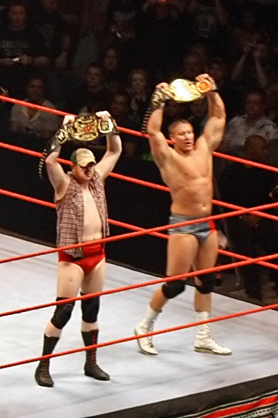 Murdoch (left) and Cade as the World Tag Team Champions.