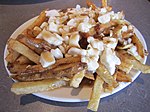 Poutine with squeaky cheese Cheese Factory poutine (5662570040).jpg