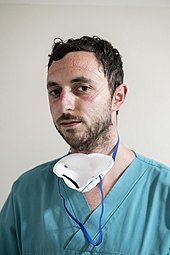 A nurse anesthetist at the San Salvatore Hospital in Pesaro, Italy, at the end of his shift on March 18, 2020 Covid-19 San Salvatore 05.jpg