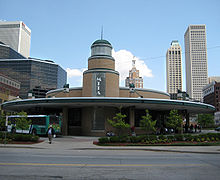 The Tulsa Transit bus network, operating from its Denver Avenue Station transit center in downtown, helps meet city infrastructure needs. Downtown Tulsa Bus Stop.jpg