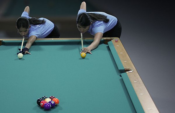 Two players competing in a lag to choose who breaks first.