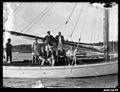 Eight men posing on a boat (7168133228).jpg