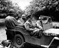 Eisenhower in jeep in Normandy orchard