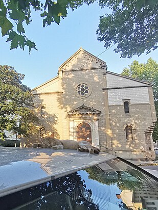 Cat napping in front of the aforementioned church