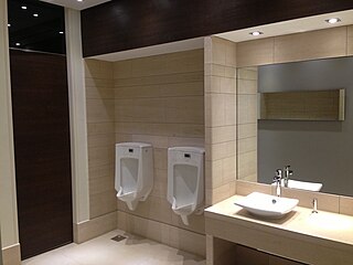 Typical common men's bathroom on all levels at the Fakhro Tower