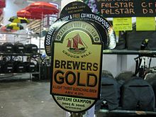 Pump clip for Crouch Vale Brewers Gold at the 2008 Great British Beer Festival, advertising it was the Supreme Champion in both 2005 and 2006. GBBF 2008 - Brewers Gold pump clip (2792123086).jpg