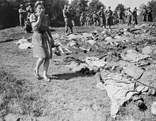 After the defeat of Nazi Germany, German civilians were sometimes forced to tour concentration camps and in some cases to exhume mass graves of Nazi victims. Nammering [de], May 18, 1945 German woman reacts to exhumed victims of a death march in Nammering.jpg