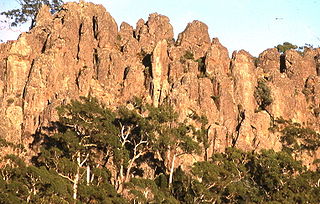 Hanging Rock is a distinctive geological formation in central Victoria, Australia. A former volcano, it lies 718m above sea level on the plain between the two small townships of Newham and Hesket, approximately 70 km north-west of Melbourne and a few kilometres north of Mount Macedon.
