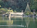 An island of weathered rocks and a single pine tree in Rikugi-en garden in Tokyo represents Mount Hōrai, the legendary home of the Eight Immortals.