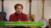 Butler speaking with Oxfam Australia about Close the Gap in 2013 John Butler Oxfam 2013.jpg