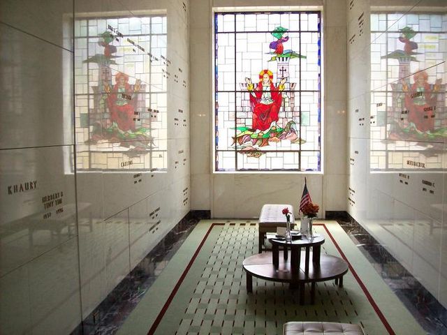 Stained glass window in one of the Mausoleum rooms; Tiny Tim's tomb can be seen at left